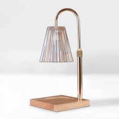 a lamp that is on top of a wooden block