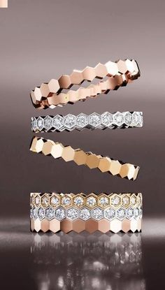 three different types of rings with diamonds on top and bottom, one in gold and the other in silver