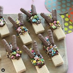 chocolate covered waffles with sprinkles and candy toppings on them