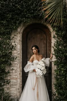 Bride in puffed sleeve wedding gown standing in an arched doorway European Romance, Wrightsville Manor, Bridal Styled Shoot, European Elegance, Wild Photography, Bridal Photography Poses, Bride Photoshoot