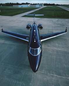 an airplane sitting on the tarmac at an airport