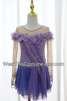 a purple and blue dress with flowers on it