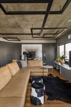 a living room filled with furniture and a flat screen tv