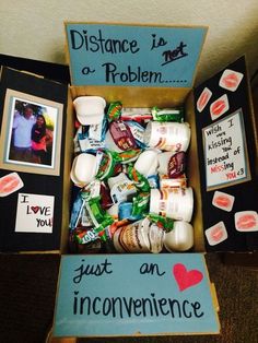 an open box filled with lots of food and condiments on top of a table