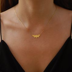 "Enter the enchanting world of the nocturnal with our Moth Necklace for the holiday season. This piece isn't just a necklace; it's a tribute to the mysterious and delicate beauty of moths, making it a sought-after item in the realm of Moth Jewelry. The intricate details on the Moth Wings Necklace capture the essence of moonlit nights and the quiet flutter of wings, ensuring you're not just wearing a piece of jewelry, but a captivating story. Immerse yourself in a world of gothic allure and let your style soar this holiday season. PRODUCT DETAILS: * Choose of Material: 925 Sterling Silver, 14K Solid Gold (real solid gold, no gold-filled or no gold plated material) * Choice of Gold Color: Yellow Gold, Rose Gold, White Gold * Closure: Spring ring * Chain style: Cable * Style: Minimalist M O R Insect Jewelry Gold, Gold Moth Necklace, Location Names, Moth Ring, Insects Jewelry, Moth Jewelry, Moth Pendant, Dangle Cross Earrings, Moth Necklace