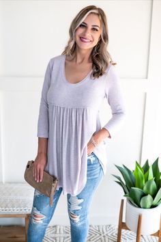 Tunics were meant to wear with the perfect pair of skinny jeans or your favorite leggings. Make sure your closet is fall-ready with this darling little gem! | Lilac | Purple | Babydoll Top | 3/4 Sleeve | Tunic | Women's Tops | Casual Tops | Summer Fashion | Spring Fashion | Trends | Style | Shopping | Cute Shirts | Cheap Tops | Cute Shirts for Women | Casual Style | Online Boutique | Plus Size Fashion | Tunic |  Babydoll Tops | Comfy | Cozy | Long Sleeve Top | Tops for Leggings | Fall Fashion