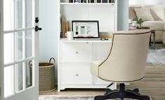 an office chair sitting in front of a desk with a computer on top of it