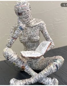 a paper mache sitting on top of a wooden table