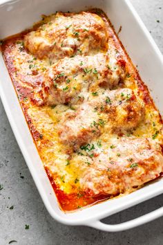 a casserole dish filled with meat and cheese