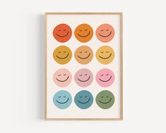 an art print with different colored smiley faces on the front and back of each one