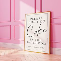 a pink room with a sign that says please don't do coffee in the bathroom