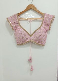 This Made to Order/Made to Measurement/Custom Made Indian Ethnic Blouse. - Fabric - Mirror Work Georgette - Color - Pink  - Princess Cut - Rich Lined - Sleeveless - Extra margin and extra stitches included in the blouse - It can be customize in any color, design or size  MEAUREMENTS & CUSTOMIZATIONS This blouse can be purchased in your standard sizing and pattern. Please choose your Chest Size (measured in inches) from the drop-down box.. For custom sizing please include the below measurements in the the notes to whenever you placed the order. * Chest size: * Waist size: * Blouse Length: * Bicep: * Arm-hole: * Sleeve Length: * Front Neck Depth: * Back-Neck Depth:  Sleaves Around PLEASE NOTE: BUYERS ARE RESPONSIBLE FOR ANY CUSTOMS AND IMPORT TAXES THAT MAY APPLY. This is a made to order pro Lehenga Blouse Designs Front Neck, Short Sleeve Lehenga Blouse, Cut Sleeve Blouse Design, Dark Pink Blouse Designs For Saree, Corset Style Blouse, Fitted Anarkali Blouse With Gota Work, Bohemian Pink Blouse With Traditional Drape, Fitted Bohemian Blouse Piece With Dori Work, Front Deep Neck Blouse