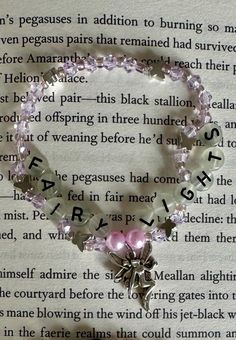 a book page with a bracelet on it