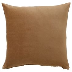 a brown pillow on a white background