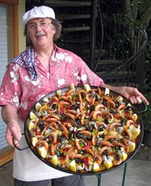 a man holding a platter full of food