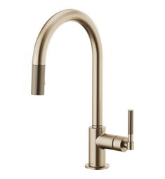 the kitchen faucet is shown in stainless steel with an angled spout and side spray