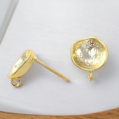 We offer only the best, high quality jewelry making supplies that are made in Korea. Our findings are genuine / real gold, rhodium, rose gold plated, never compromised on quality. Shop with Confidence! 4 Matte gold round circle vintage style earrings There is a loop hidden behind so you can hang gemstones, pearls, CZ, glass, crystals, charms, and so on to create customized handmade jewelry. This simple design makes it perfect for casual jewelry. Item details Finish: Matte 14K gold plated Base-me Gold Round Earrings With Bezel Setting, Gold Round Earrings With Prong Setting, Yellow Gold Round Earrings, Round Circle Design, Vintage Style Earrings, Casual Jewelry, Gold Stud Earrings, Round Circle, Gold Stud