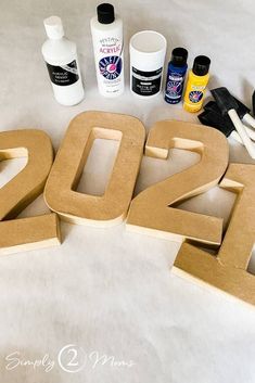 the letters are made out of cardboard and glue to make numbers for new year's decorations