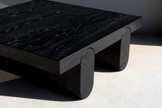 Gravity is a low-profile, square coffee table treated with black dye to give the wood an oxidized appearance. Gravity is one of our thickest pieces to date, featuring a 4” top with equally thick legs. Gravity’s  weighty construction is offset by the soft curves of its recessed, pill-shaped cylindrical bases. Low Profile Coffee Table, Coffee Table Low, Charing Cross, Live Edge Furniture, Square Coffee Table, Dining Room Inspiration, Coffee Table Square, Modern Dining Room, Modern Coffee Tables