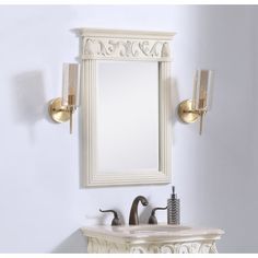 a white sink sitting under a mirror next to a faucet mounted on a wall