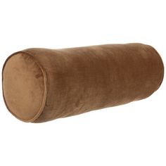 a brown pillow that is sitting on top of a white wall and it's rolled up