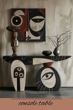 the console table is decorated with modern art