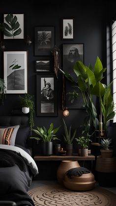 a bedroom with black walls, plants and pictures on the wall above the headboard