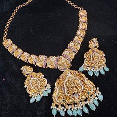 "Handmade Indian Jewelry item * Stunning Hand made Gold Plated Lakshmi temple design set. * Necklace Set is a combo of Necklace & Stud Earrings *Gold Color is Matte gold tone which has a copper hue as opposed to bright gold  * Necklace is adjustable with adjustable back chain * Necklace Length: 14\",  * Packed in box , Ideal For GiftingOn Request, We Can Add A Custom Message  For Your Loved One (At No Additional Cost) :) Color, shades, texture displayed may slightly vary from the actual product due to digital image limitations. We request you to consider these minor variations. Please expect the possibility of some slight imperfections when buying hand made jewelry. If you have any questions, please contact us. CARE: Keep jewelry away from direct heat, water, perfumes, deodorants and other Luxury Gold Plated Temple Necklace For Diwali, Luxury Ceremonial Temple Necklace With Tilla Detail, Luxury Ornate Temple Necklace, Luxury Temple Necklace For Diwali, Lakshmi Temple, Gold Hat, Jewelry Traditional, Back Chain, Temple Jewelry