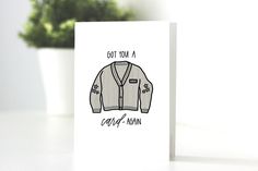 a white card with a drawing of a sweater on it and the words got you a cozy - warm