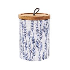 a blue and white canister with a wooden lid that has an image of wheat on it