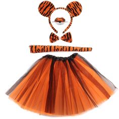 an orange tutu skirt and headband with tiger ears on it, sitting in front of a white background