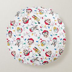 mickey's friends christmas pattern round pillow on white background with red and green trim