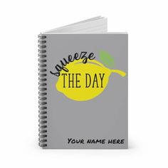 a spiral notebook with the words, you name here on it and a lemon design