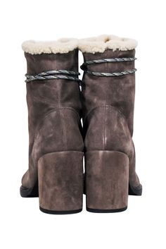 Get your winter style game on point with these Stuart Weitzman grey suede lace up short boots! Featuring a cozy cream shearling lining and trim, they pair perfectly with a statement coat and jeans for all your cold weather activities. Stay warm and chic all season long. Size 9 Suede upper Shearling lining Lace up front Chunky heel Minor wear and rubbing on corners at opening Heel height 3.5" Shaft 6.5" Lace-up Winter Boots With Suede Lining, Brown Lace-up Boots With Suede Lining For Winter, Brown Winter Lace-up Boots With Suede Lining, Winter Boots With Suede Lining And Shearling Material, Winter Suede Ankle Lace-up Boots, Winter Lace-up Boots With Suede Lining, Shearling Lace-up Winter Boots, Cold Weather Activities, Statement Coat