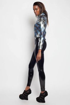 These 4-way stretch vinyl leggings are super shiny and fit like a second skin. Made from extra stretchy PVC, they are super futuristic! Perfect pants for any cyber, techno, EDM, rave, cybergoth, goth, industrial, streetwear, clubwear or festival wardrobe!  Size M has an inseam of approx 28 1/4  Pictured with the Draco vest and Intrepid Peplum top. Click here to purchase: https://www.etsy.com/listing/203600843/draco-vest-red-gothic-industrial-vegan  https:/&#... Punk Style Stretch Leather Pants For Party, Fitted Shiny Metallic Leather Pants, Stretch Punk Leggings For Night Out, Punk Style Stretch Leggings For Night Out, Fitted Alternative Leggings For Night Out, Alternative Style Fitted Leggings For Night Out, Fitted Alternative Style Leggings For Night Out, Fitted Punk Leggings For Party, Punk Style Fitted Party Leggings