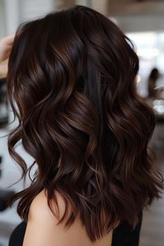 Woman with long, wavy, dark brown hair, styled in loose curls. Chocolate Brown And Caramel Highlights, Black Hair With Chocolate Highlights, Dark Brown Hair Caramel Highlights, Highlights Color Ideas, Chocolate Brown Hair With Highlights, French Balayage, Highlights Hair Color Ideas, Rich Chocolate Brown Hair, Red Brown Hair Color