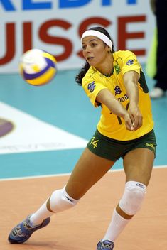 a female volleyball player in action on the court