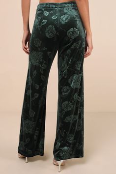 With stylish and sophisticated vibes aplenty, we can't get enough of the Lulus Sensational Attitude Emerald Green Burnout Velvet Wide-Leg Pants! Stretchy, plush velvet boasts a chic burnout floral effect as it shapes these elevated pants that have a high waist and wide, breezy legs that end at ankle-length hems. Hidden zipper/clasp at the back. Pair with the matching top for a complete look! Fit: This garment fits true to size. Length: Floor length. Size medium Inseam: 31.00 Front Rise: 13.50 Wa Green Wide-leg Pants For Night Out, Green Full-length Bottoms For Night Out, Party Pants With Elastic Waistband In Green, Green Trousers For Night Out, Burnout Velvet, Velvet Pants, Matching Top, Hidden Zipper, Ankle Length