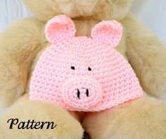 a teddy bear with a crocheted pig hat on it's face and the words pattern written below