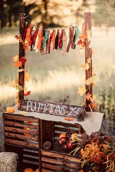 an outdoor display with pumpkins and fall leaves