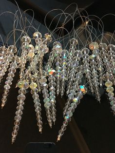 several crystal chandeliers hanging from the ceiling