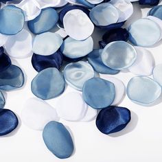 blue and white glass pebbles on a white background