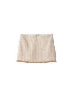 Miu Miu's Tweed Mini Skirt is a classic from the brand. This variation features a glass embellished gold trim and features an A-line silhouette that falls to the mid thigh. Pair with the matching jacket to complete the look. [tab] Composition: Virgin wool; Lining: Viscose Size and Fit: Runs True to Size Care Instructions: Professional cleaning recommended Origin: Imported SKU: MIU49PH19 Questions about size, fit, or how to style? The KZ team is here to help you look and feel your best! Chat with