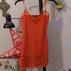 Y2k Era Burnt Orange Adjustable Spaghetti Strap Cami Tank Top With Long Lace Bottom. Lace Detail At Top. Perfect For Layering. Brand New Never Worn. Summer Y2k V-neck Camisole, Y2k Style Camisole For Night Out In Summer, Y2k Style Spaghetti Strap Camisole For Night Out, Y2k Camisole With Spaghetti Straps For Night Out, Fitted Orange Spaghetti Strap Tank Top, Fitted Orange Camisole Casual Style, Fitted Orange Spaghetti Strap Top, Spring Spaghetti Strap Camisole, Fitted Orange Camisole For Summer