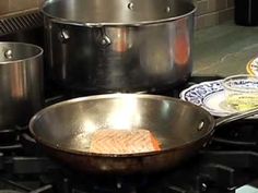 several pots and pans sitting on top of a stove next to each other with food in them