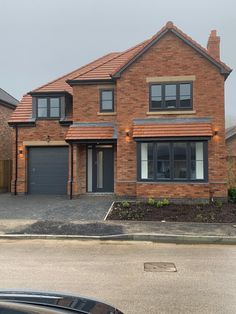 a large brick house with two garages