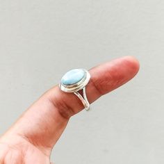 "Important : PLEASE ENTER YOUR PHONE NUMBER IN THE \"NOTE TO SELLER\" SECTION DURING CHECKOUT, SO THAT THE DELIVERY CAN BE HASSLE FREE. Stone : Larimar Metal : 925 Sterling Silver Stone Size : Varies(According to the ring size) Shape : Oval Ships Worldwide from India 925 stamped Handmade Item ABOUT Larimar ♥ Facilitating inner wisdom and outer manifestation Larimar is an earth-healing stone. It connects with nature and will counteract inbalances in the earth's energy, it promotes self-confidence Handmade Turquoise Larimar Ring For Anniversary, Handmade Turquoise Larimar Rings, Round Larimar Rings As A Gift, Turquoise Larimar Round Ring, Adjustable Larimar Rings As Gift, Turquoise Larimar Ring, Adjustable Larimar Turquoise Ring, Adjustable Turquoise Larimar Ring, Larimar Rings