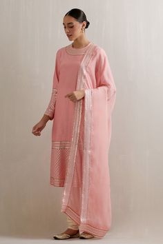 Chalk pink kurta with aari, sequin, zari embroidered neckline and sleeve hem. Paired with cotton cream churidar and dupatta. - Aza Fashions Festive Pink Kurta With Mirror Work, Designer Pink Kurta With Mirror Work, Pink Mirror Work Kurta For Designer Wear, Pink Traditional Straight Kurta With Mirror Work, Pink Traditional Wear With Mirror Work Straight Kurta, Pink Straight Kurta With Mirror Work, Pink Kurta With Mirror Work For Festivals, Pink Traditional Wear With Mirror Work For Transitional Season, Transitional Pink Traditional Wear With Mirror Work