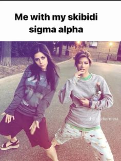 two girls standing next to each other in the street with text that reads me with my skiidi stigma alpha