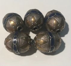 These are vintage Turkmen tribe silver gold gilded beads from Northern Afghanistan. It is all handmade by the best Turkmen tribe bead maker.  The beads are about 20 years old. Size: 1.1 inch long and 21mm In diameter The price is for 5 beads Traditional Jewelry With Bead Caps And Round Beads, Silver Beaded Cabochons For Jewelry Making, Gold Bohemian Beads For Jewelry Making, Vintage Silver Beaded Beads, Handmade Silver Oval Beads, Silver Spiritual Beads For Festivals, Silver Spiritual Jewelry With Gold Beads, Traditional Spacer Beads For Festivals, Artisan Silver Beads For Festival